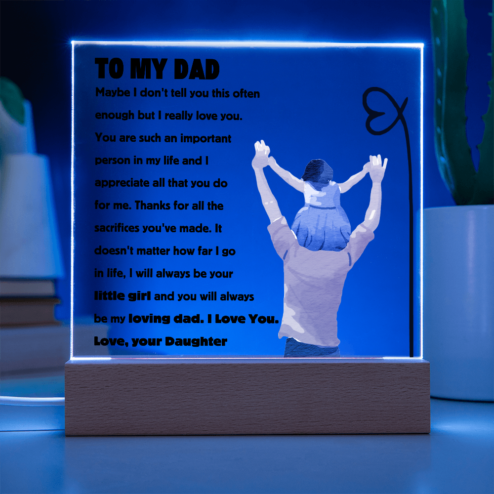 Square acrylic plaque with 'To My Dad' message, featuring a silhouette of a child on a father's shoulders, vibrant lighting, and decorative text.