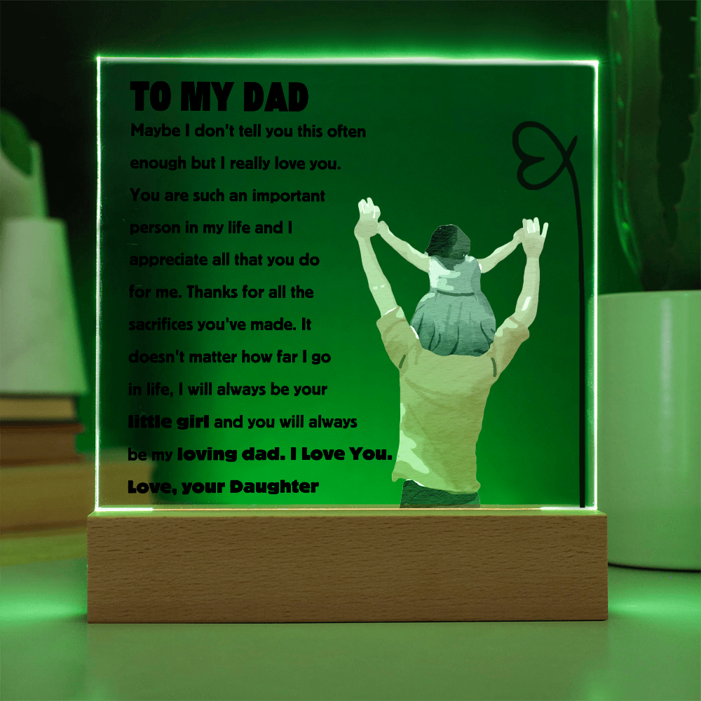 Square acrylic plaque with laser-engraved quote 'To My Dad' and a father holding daughter illustration, illuminated background