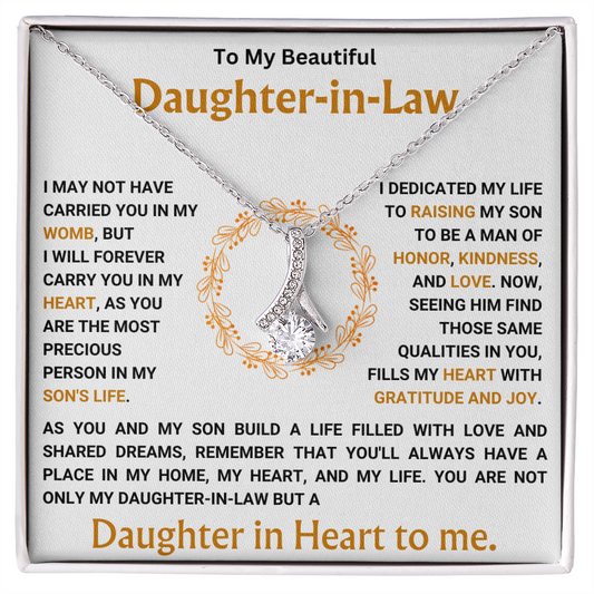 Alluring Beauty necklace with ribbon pendant for daughter-in-law, featuring heartfelt message in decorative box.