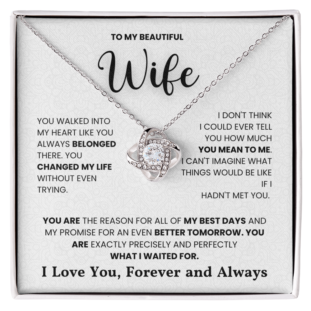Love Knot Necklace on a gift box with heartfelt message, featuring cubic zirconia in 14k white gold or 18k yellow gold over stainless steel.
