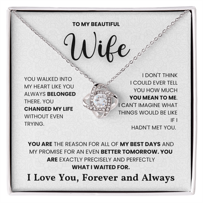 Love Knot Necklace on a gift box with heartfelt message, featuring cubic zirconia in 14k white gold or 18k yellow gold over stainless steel.