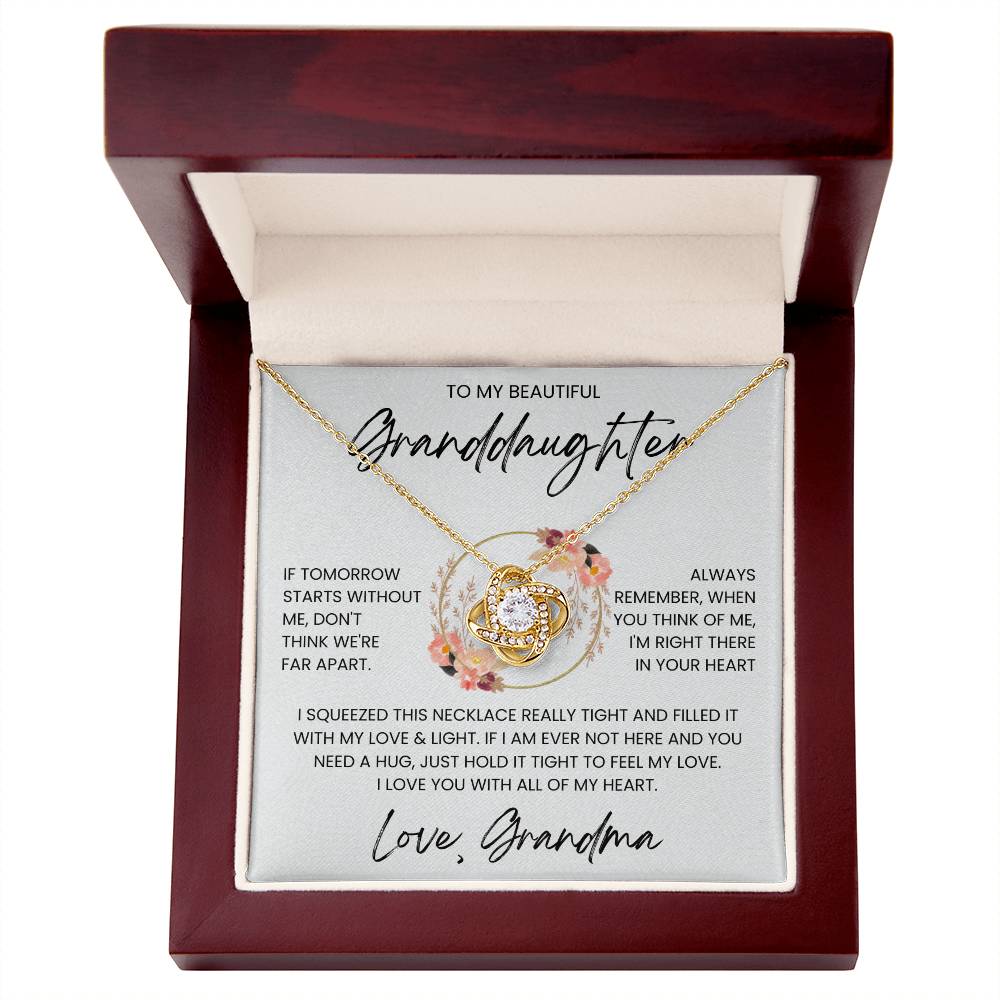 Love Knot Necklace in gift box with heartfelt message for granddaughter, featuring cubic zirconia and gold, symbolizing unbreakable bond.