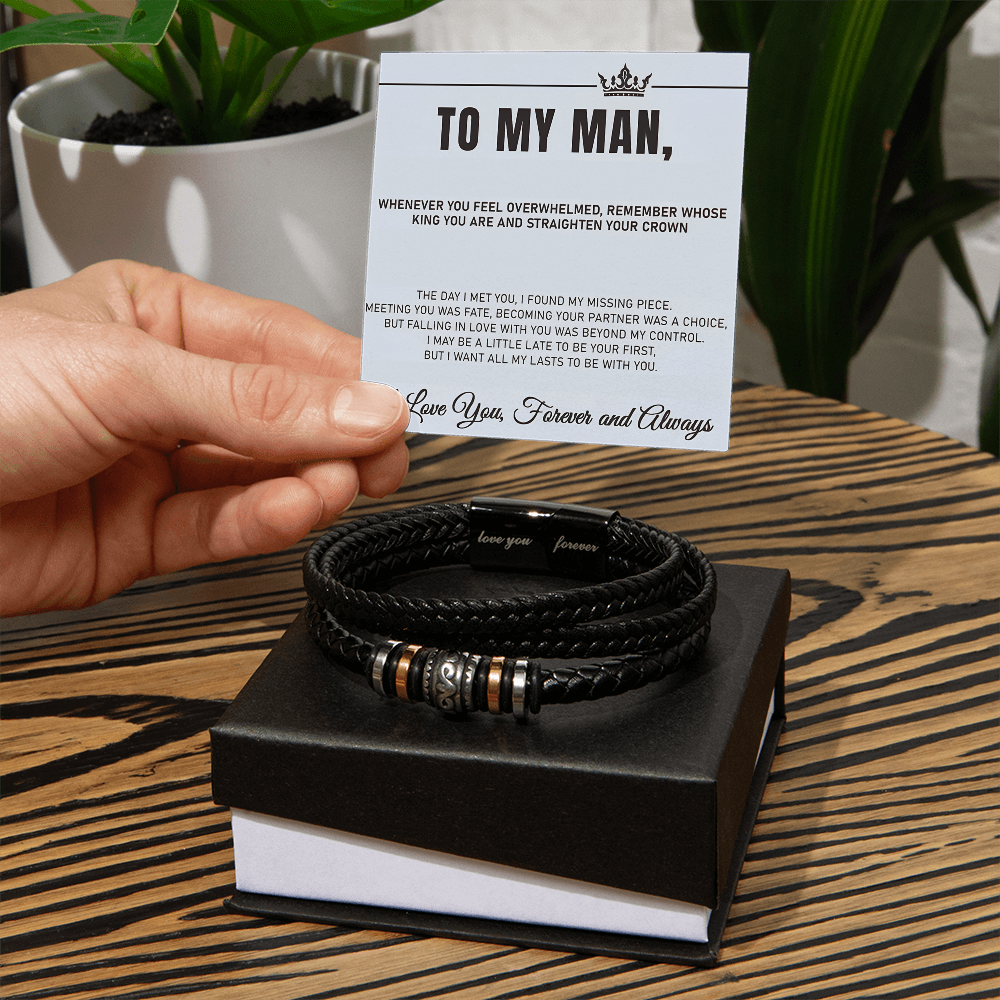 Man holding 'Love You Forever' black bracelet with engraved message card, perfect gift for special occasions like anniversaries or birthdays.