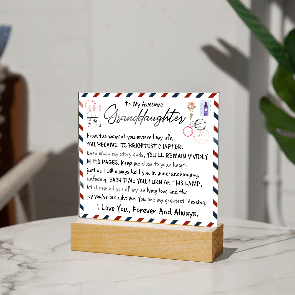 Acrylic plaque on wooden base with love letter design for granddaughter, featuring heartfelt message from grandparent. Sentimental gift.