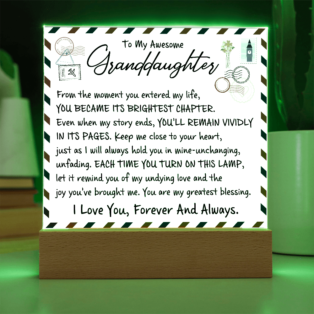 Heartfelt acrylic plaque gift from grandparent to granddaughter with a glowing wooden base, featuring a love letter design.